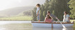 Family in rowboat on lake