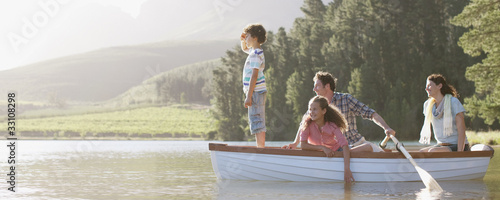 Photo: Family in rowboat on lake Family in rowboat on lake