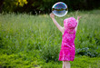 A girl is blowing bubbles