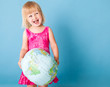 A little girl with a globe