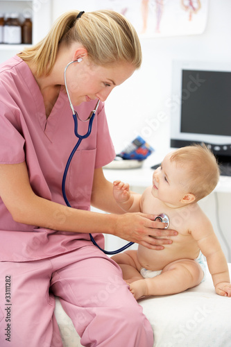 Photo: Pediatrician with baby Pediatrician with baby