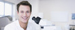 Scientist with microscope in laboratory