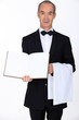 A waiter with a blank book