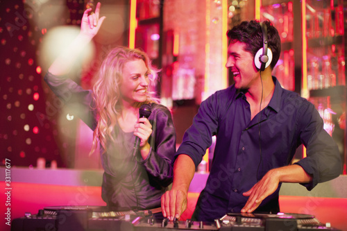 Photo: DJ and singer in nightclub DJ and singer in nightclub