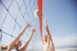 Friends playing volleyball