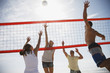 Friends playing volleyball