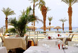 Cafe on the beach among the palm trees