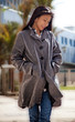 ����: Pretty Woman Smiling with a Long Coat Outdoors � johnnydao #33122024