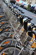 bikes for rent: the same bicycles parked in a row