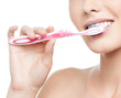 woman brushing her teeth