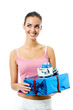 Young smiling woman with gift, isolated on white