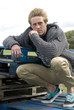 man leaning on crates man leaning on crates