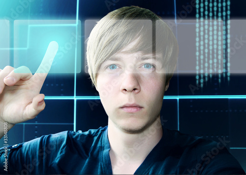 Photo: Young Man and Touchscreen Interface Young Man and Touchscreen Interface