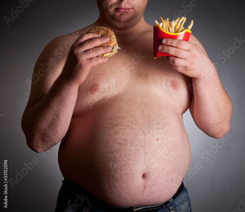 Photo: Fat man with hamburger and chips Fat man with hamburger and chips