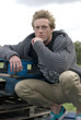 Man leaning on a crate