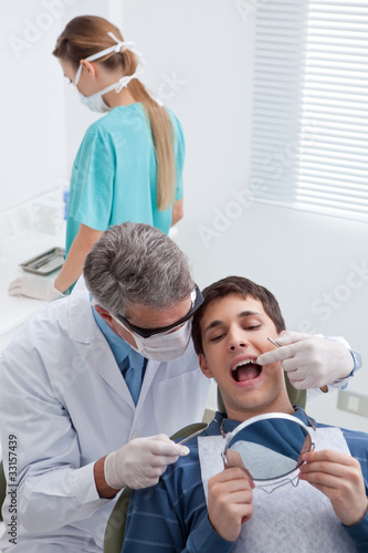 Photo: Patient receiving dental treatment Patient receiving dental treatment