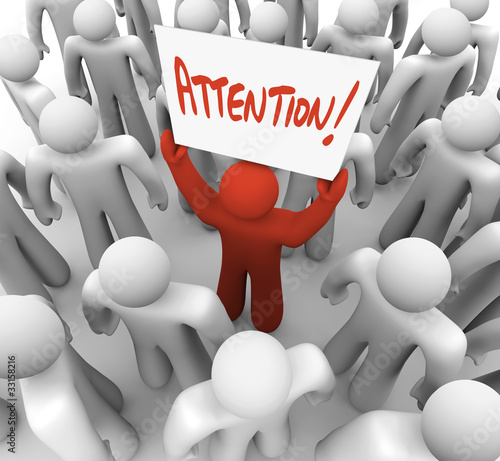 Illustration: Person Holding Attention Sign in Crowd to be Recognized Person Holding Attention Sign in Crowd to be Recognized