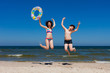 Kids jumping on beach