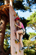 Girl climbing in adventure park