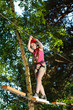 Girl climbing in adventure park Girl climbing in adventure park