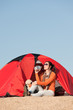 Camping happy woman sitting front of tent Camping happy woman sitting front of tent