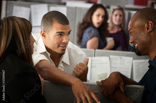 Photo: Office Workers Gossiping Office Workers Gossiping
