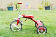 Old Red Kids Bike on The Grass Old Red Kids Bike on The Grass