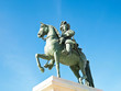 Statue of Louis XIV in front of versailles palace near Paris