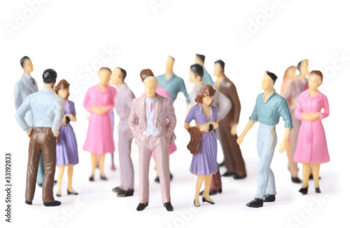 Photo: toy people stand in different poses isolated toy people stand in different poses isolated
