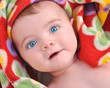 Surprised Baby in Red Blanket Surprised Baby in Red Blanket