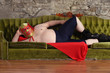 Photo: Mexican wrestler lying on a couch Mexican wrestler lying on a couch