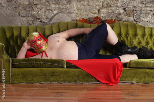 Photo: Mexican wrestler lying on a couch Mexican wrestler lying on a couch