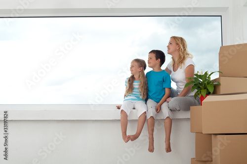 Photo : Happy people in their new home - the future is bright Happy people in their new home - the future is bright