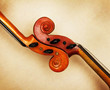 Photo: two old violin scrolls detail in ambient light two old violin scrolls detail in ambient light
