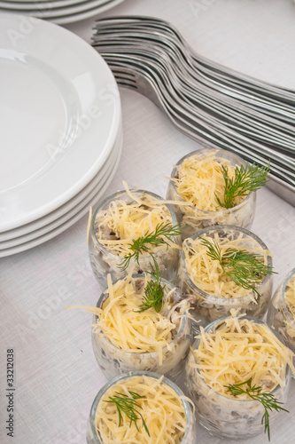 Foto: banquet table with salad and tableware banquet table with salad and tableware