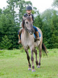 Horse riding - little girl is riding a horse