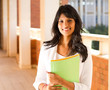 female university student in school passage