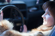 woman in her car