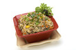 Pancit in a red ceramic dish