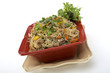 Pancit in a red ceramic dish