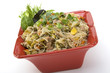 Pancit in a red ceramic dish