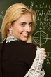 Cute smiling school girl in a classroom Cute smiling school girl in a classroom