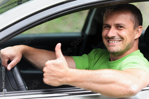 Photo: Happy young man with new car Happy young man with new car