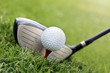 .Golf club and ball in grass .Golf club and ball in grass