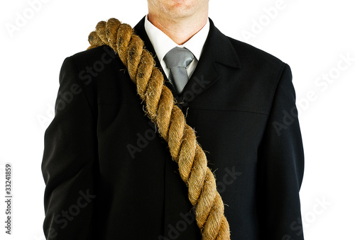 Photo: businessman carrying rope businessman carrying rope