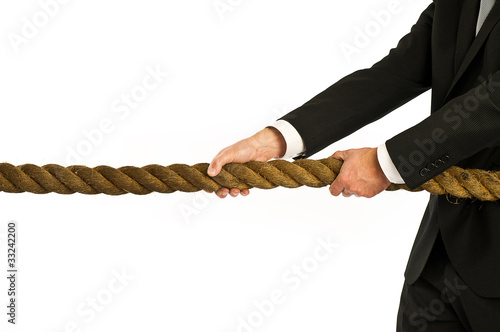 Photo: businessman pulling rope businessman pulling rope