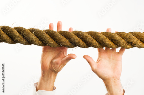 Photo: hands reaching to rope hands reaching to rope