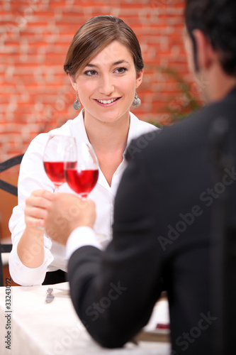 Photo: Couple drinking rose wine in a restaurant Couple drinking rose wine in a restaurant