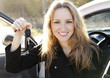 Photo: Beautiful young happy woman with car keys. Beautiful young happy woman with car keys.