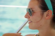 Pretty young woman relaxing on sailboat
